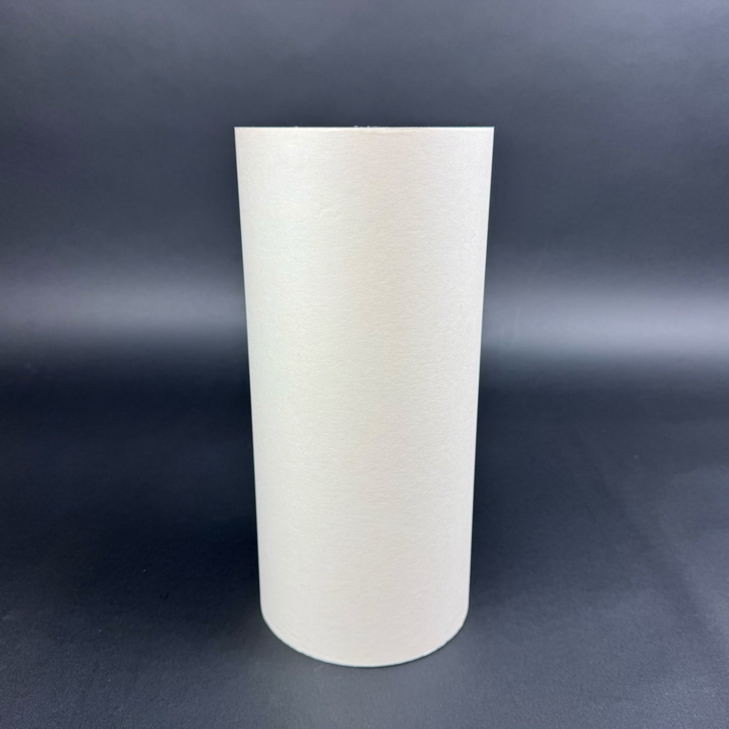 White carrier tape roll paper on a dark gray background